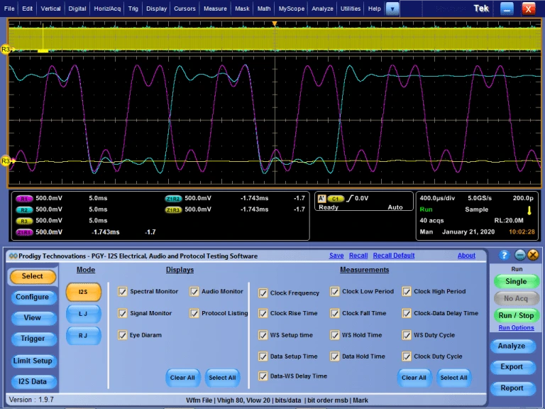 A professional testing interface displaying a dark oscilloscope grid with multiple color-coded waveforms (purple, yellow, and blue) at the top and the Prodigy Technovations PGY-I2S software control panel with various measurement checkboxes at the bottom.